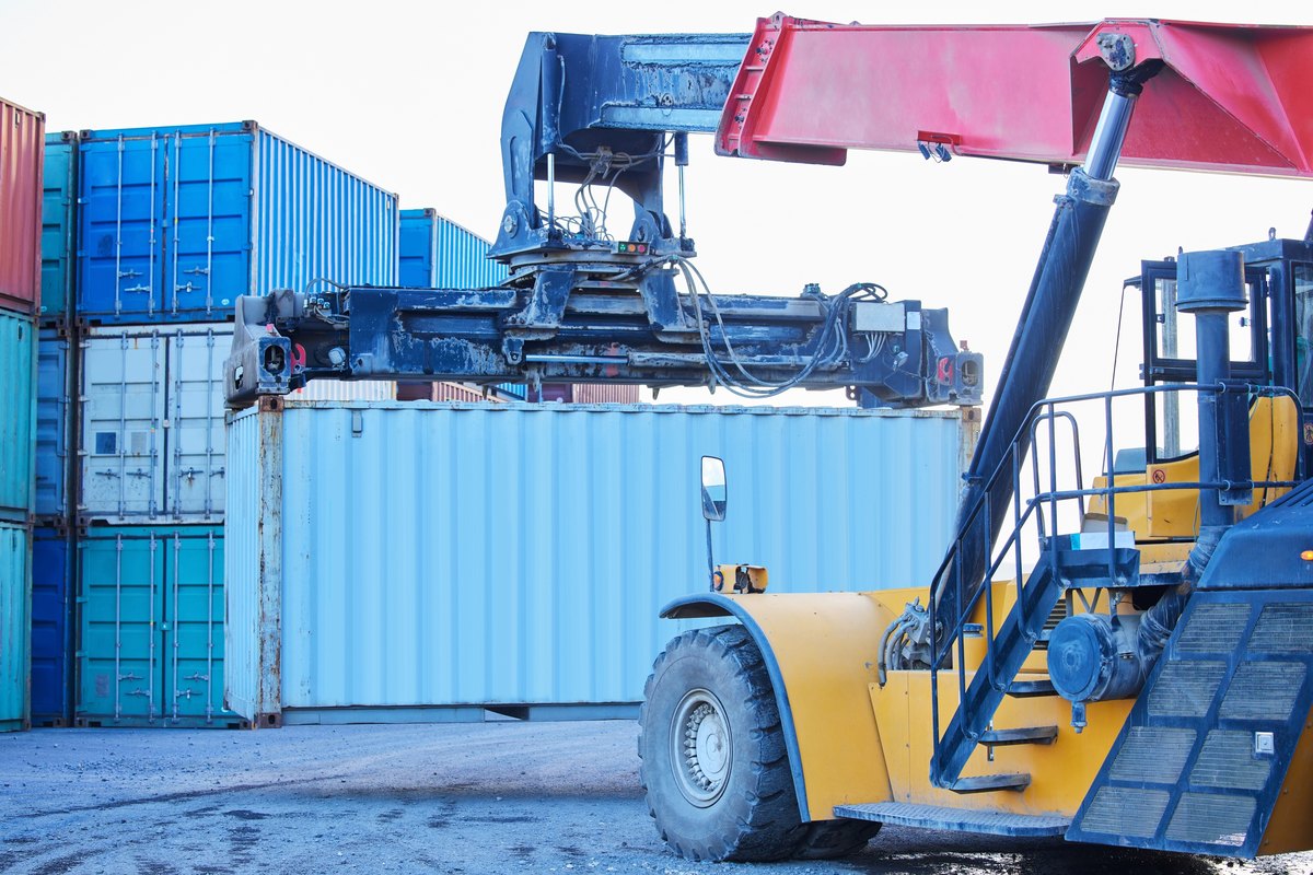 Logistics container and truck moving cargo on an international and global shipping port supply chain delivery and freight transport stock to be export transport and courier to distribution center